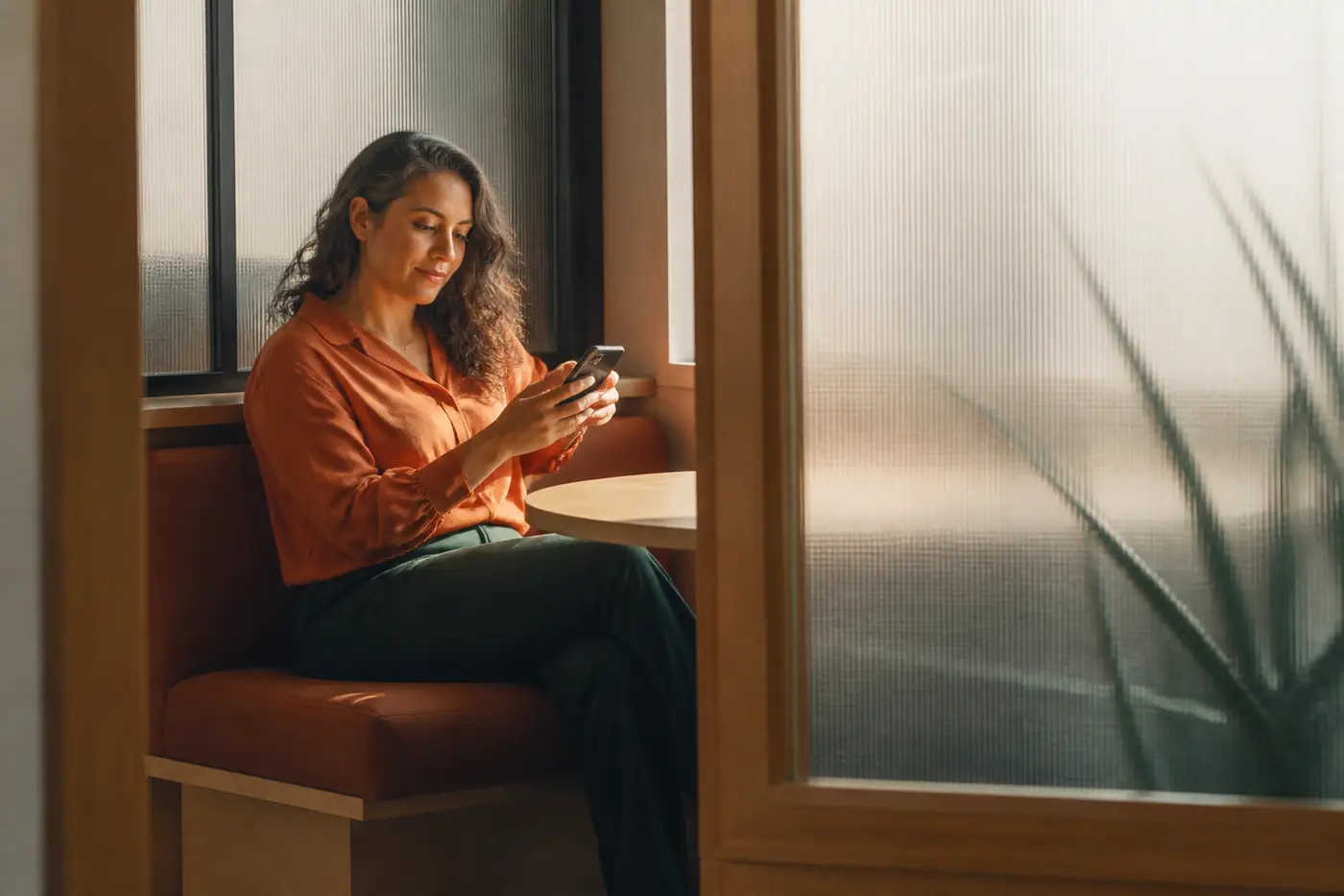 An employee privately reviewing a vendor privacy checklist in a quiet office booth